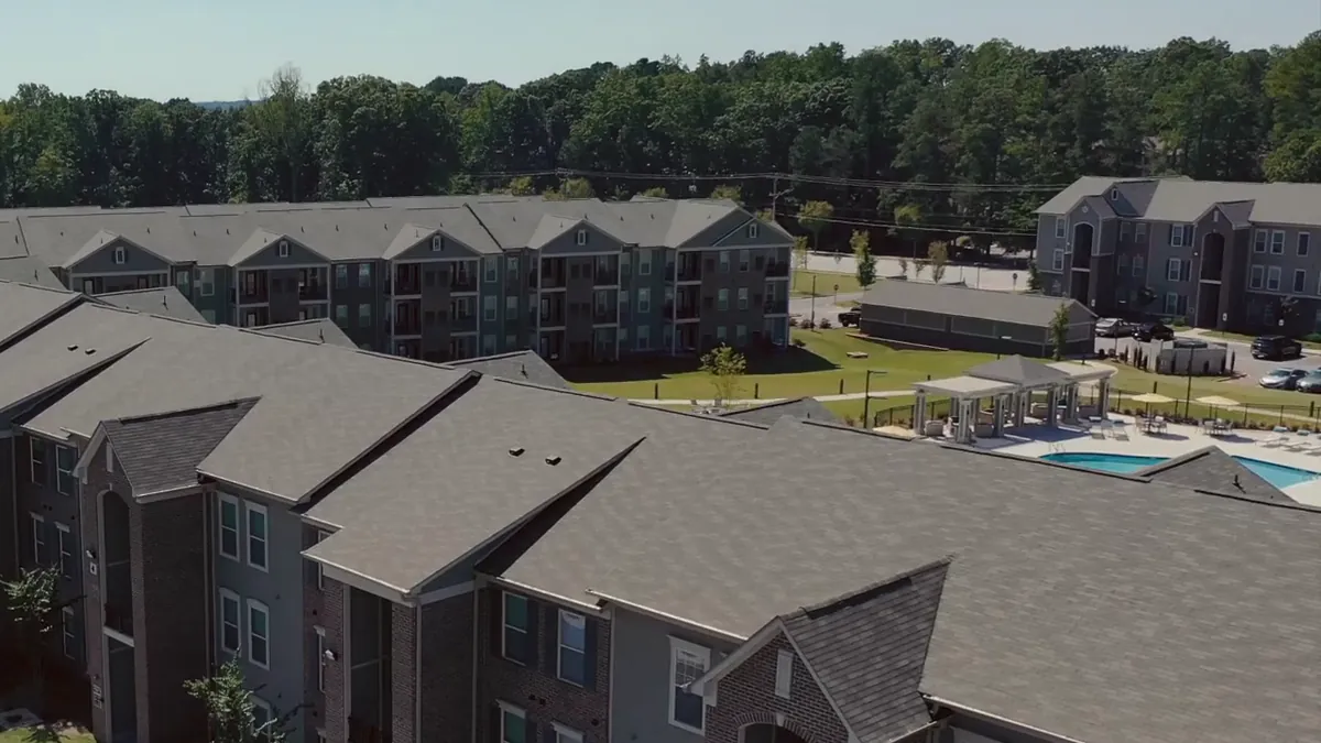 Apartment buildings and the community pool from the air