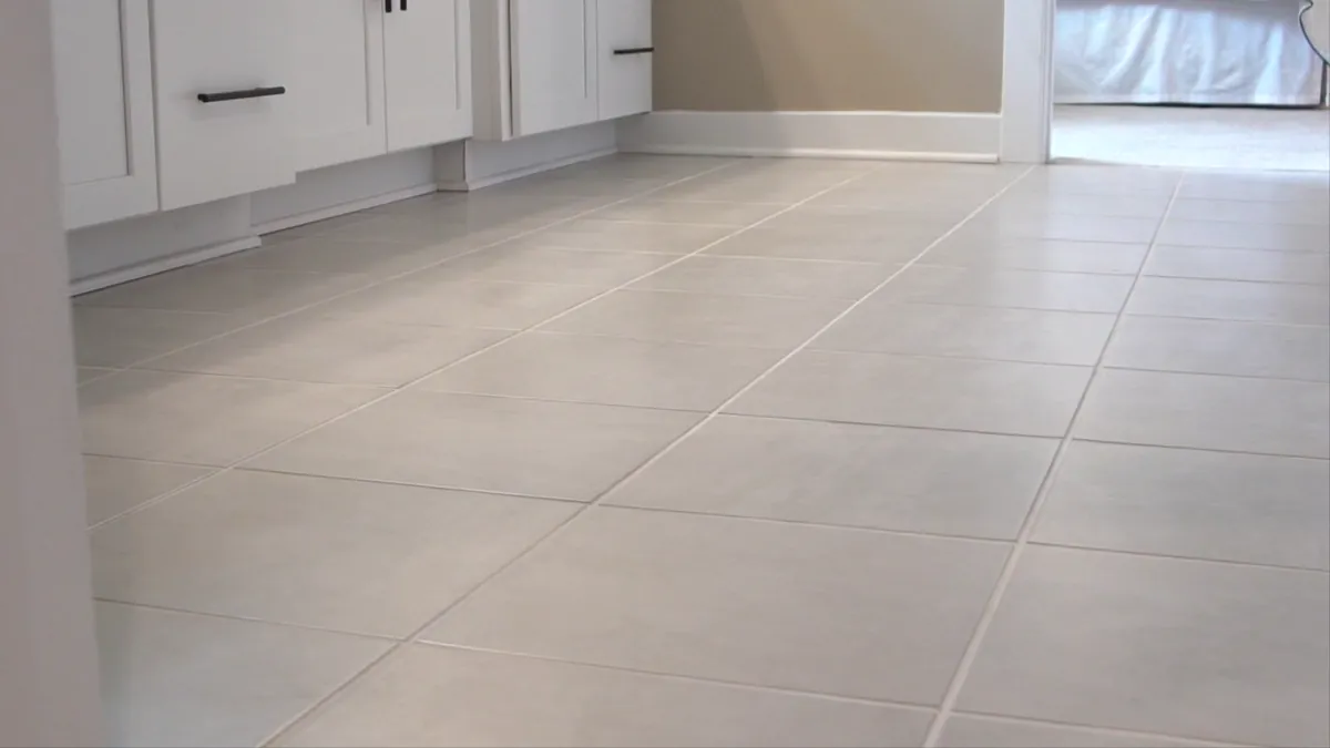 Light tile floor in a finished kitchen