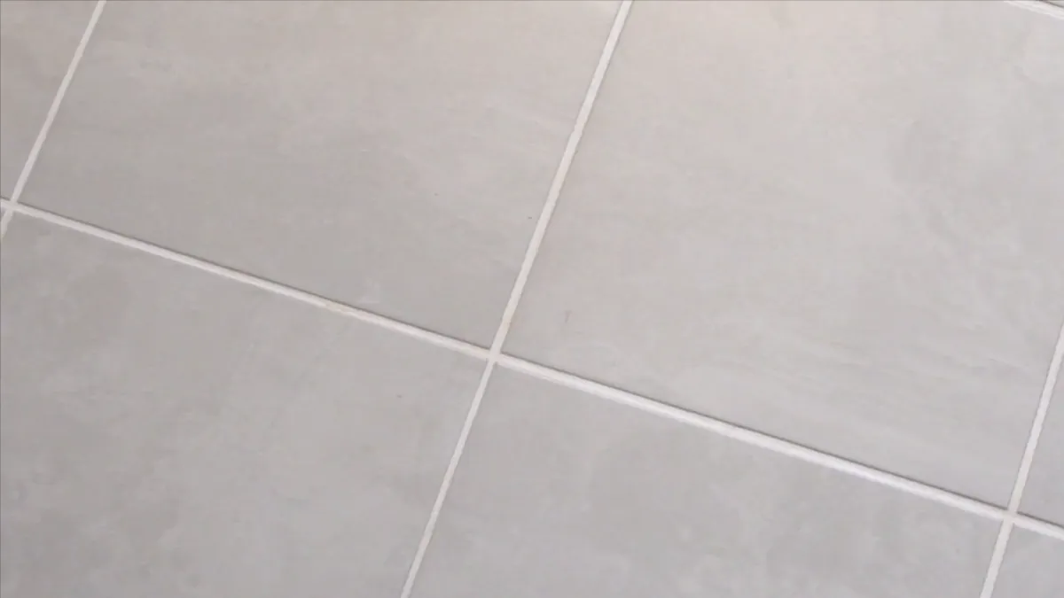 Light gray tile laid on a straight grid